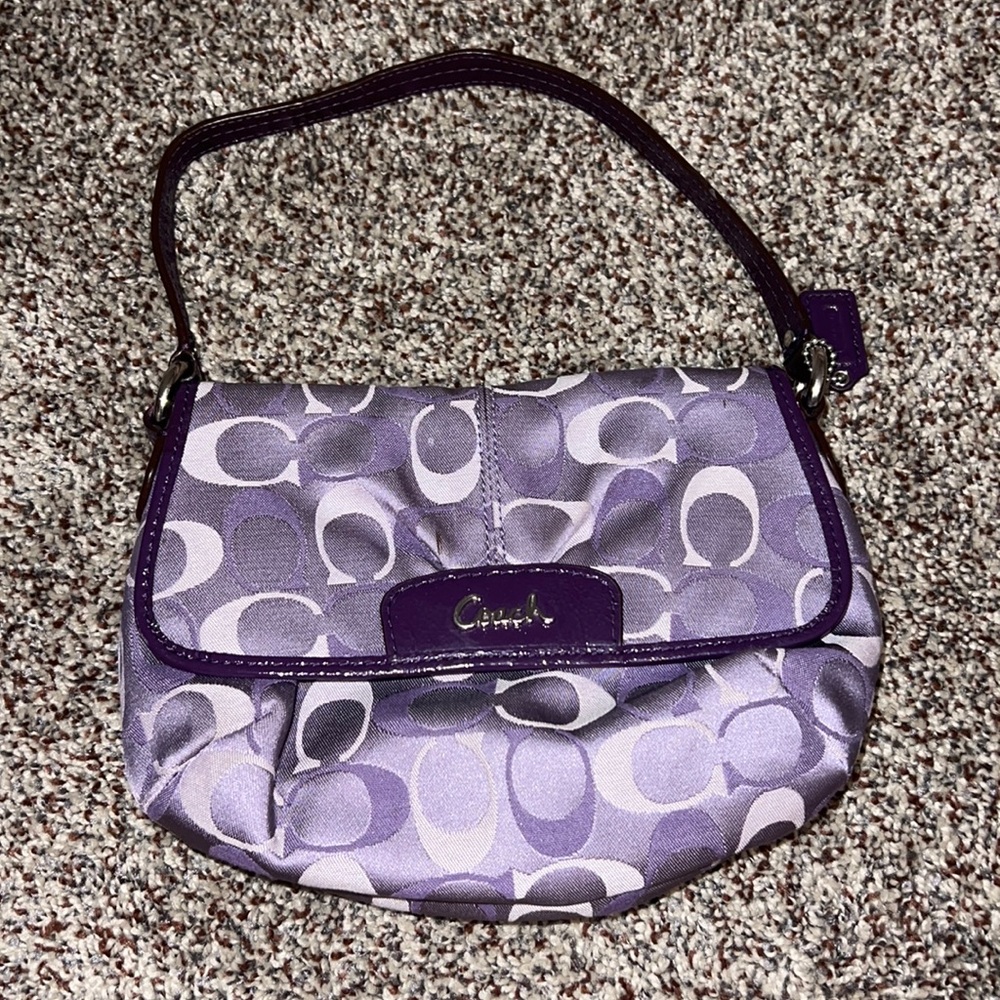 Small purple Coach purse with small wallet.